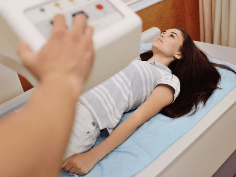 young woman checking the density of her bone tissue