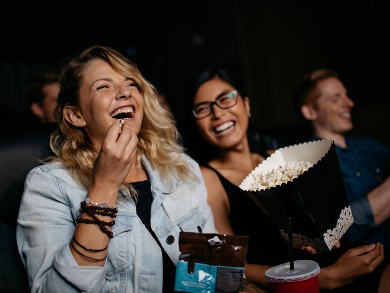 Youth eating popcorn